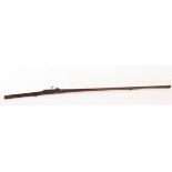 An 18th Century matchlock rifle with a walnut stock and octagonal steel barrel, mount and a ramrod,