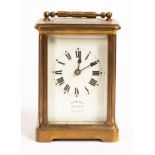 A gilt brass cased carriage clock, the white enamel dial signed Warren, Eastbourne, Sevenoaks,