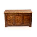 19th Century oak coffer with hinged lid, the three front panels decorated inlaid diamond pattern,