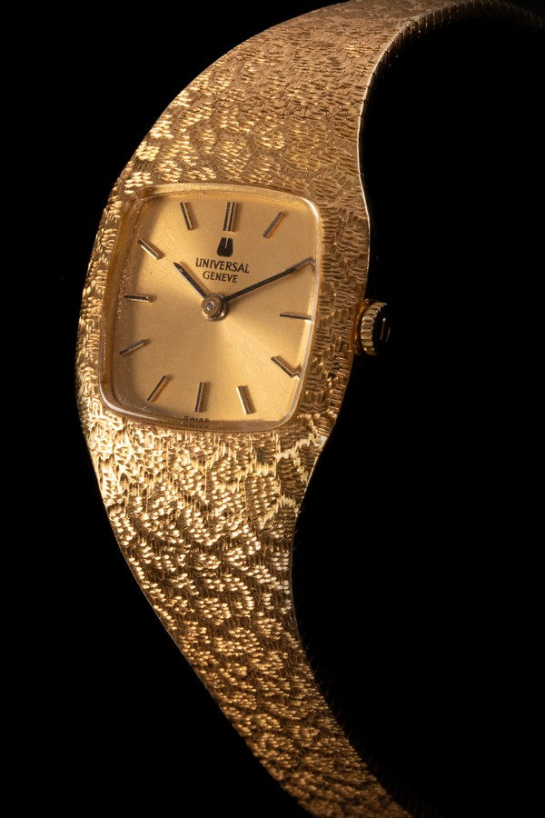 A lady's Universal Geneve wristwatch, the square dial with gilt baton markers,