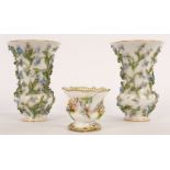 A pair of late 19th Century Meissen porcelain vases encrusted with flora,