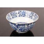 A Chinese blue and white porcelain bowl, decorated with lotus flowers and scrolling foliage,