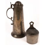 A pewter flagon with scrolled handle and lid, 32cm high and a pewter candle holder, 10.