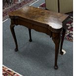 A George II mahogany tea/card table, the rectangular top with lobed front corners,