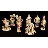 A group of mostly 19th Century porcelain figures to include a Derby figure of girl with a cat on