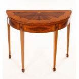 A late 18th Century satinwood card table, the top inlaid batswing patera,