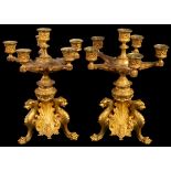 A pair of gilt metal table candelabra, late 19th Century, each with five branches and six lights,