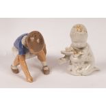 A Bing & Grondahl blanc de chine figurine of a child with seaweed, printed 2266 to base,