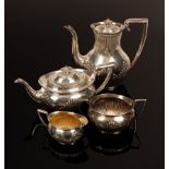 A four-piece silver tea and coffee service, BB, Birmingham 1901, half-ribbed with C scroll handles,