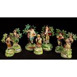 Seven Staffordshire pearlware bocage figures comprising a pair of Walton shepherd and shepherdess,