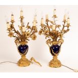 A pair of five-light table lights with gilded floral and foliate decoration,