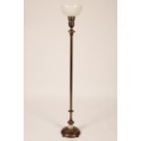 A bronzed metal torchere of Art Deco design with brass detailing, 151cm high,