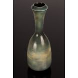 Peter Lane (born 1932), porcelain bottle vase with graduated blue/grey glazes, incised signature,