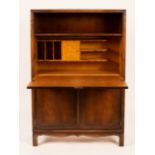 Style of Sir Robert Lorimer and Whytock and Reid, an Art Deco bureau with floral carved corners,