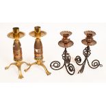 A pair of copper and wrought iron candlesticks,