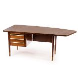 A Mid Century Danish teak wood desk with asymmetric top,