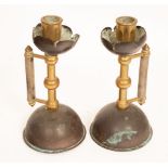 Two pairs of Aesthetic movement candlesticks in the style of Christopher Dresser for Benham & Froud,