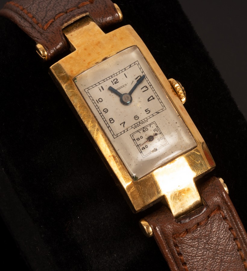 A Longines gold watch with leather strap and a pair of striped cufflinks CONDITION