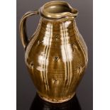 Mike Dodd (born 1943), tall stoneware jug, green ash glaze with incised line decoration,