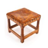 A Gordon Russell & Sons oak stool, square section with carved legs and dowelled joints,