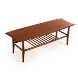 Everest for Heals, a teak surfboard type coffee table, with slatted magazine rack under,