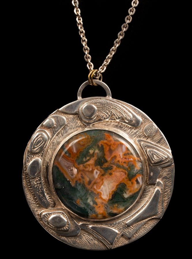 A silver and moss agate pendant by Helen Newman, Birmingham 1974,