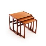 G-Plan, a Quadrille nest of three tables in teak, red sticker, the largest 54cm wide,