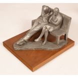 Amelia Shaw-Hastings, a modern plaster sculpture of a couple seated on a bench, initialled AH,