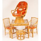 A suite of cane furniture comprising a table, pair of chairs,