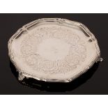 A Victorian circular silver waiter, marks rubbed, with ribbon tied thread borders,
