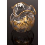 A spherical ribbed glass vase with quatrefoil flange top, finely gilded with acanthus scrolls,