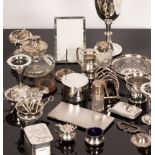 A silver prize cup, various silver vases, jugs, a gravy boat, cigarette cases and other silver,