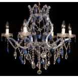 A Venetian style six-branch chandelier in clear and blue tinted glass hung with prismatic drops,