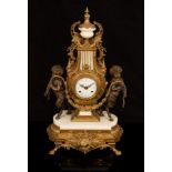 A modern gilt metal cased mantel clock of lyre form, flanked by satyrs, fitted a battery movement,