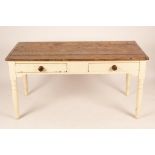A pine kitchen table fitted two drawers on turned legs,