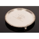 A George IV circular silver tray, William Eaton, London 1823, with engraved floral border,