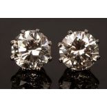 A pair of brilliant cut diamond ear studs, approximately 2.