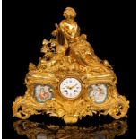A gilt metal and porcelain mounted mantel clock, the white enamel dial with blue numerals,