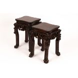 A pair of Chinese hardwood stands, the tops with beaded borders,