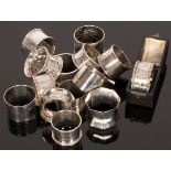 An assorted collection of fourteen silver napkin rings, Victorian and later, one cased,