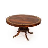 A fine Regency rosewood dining table, the top with brass inlaid border,