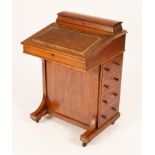 A late Victorian mahogany Davenport with bank of four drawers to one side,