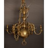A Dutch style six-branch brass chandelier, fitted for electricity,