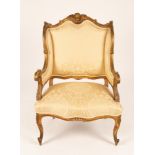 A Louis XVI style fauteuil with gilt show wood frame,