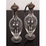 A pear-shaped claret jug and decanter both with silver mounts and covers, MJP Birmingham 2000,