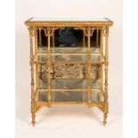 A 19th Century rectangular étagère with mirrored shelves and carved pillar supports,