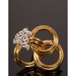 A diamond brooch set in 18ct yellow gold, modelled as three interlocking rings, 25mm x 28mm,