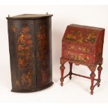 A Chinoiserie black, red and gold lacquer bureau of two drawers on turned legs,