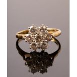 A diamond cluster ring, JWLd, the seven-stone cluster set in 18ct yellow gold,