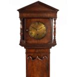 A mahogany Grandmother clock, the hood with triangular pediment,